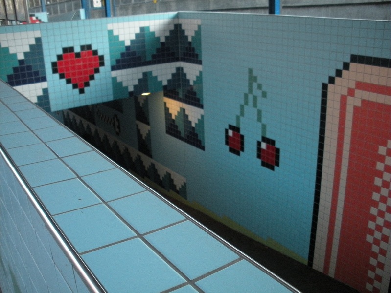 Thorildsplan metro station Stockholm with green-and-red 8-bit pixel art tiled walls