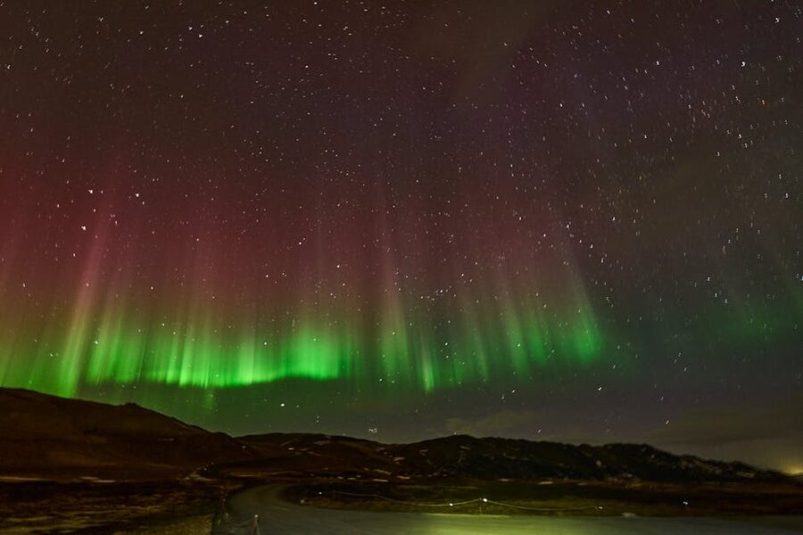 Aurora borealis over Þingeyjarsveit in north Iceland's dark winter sky