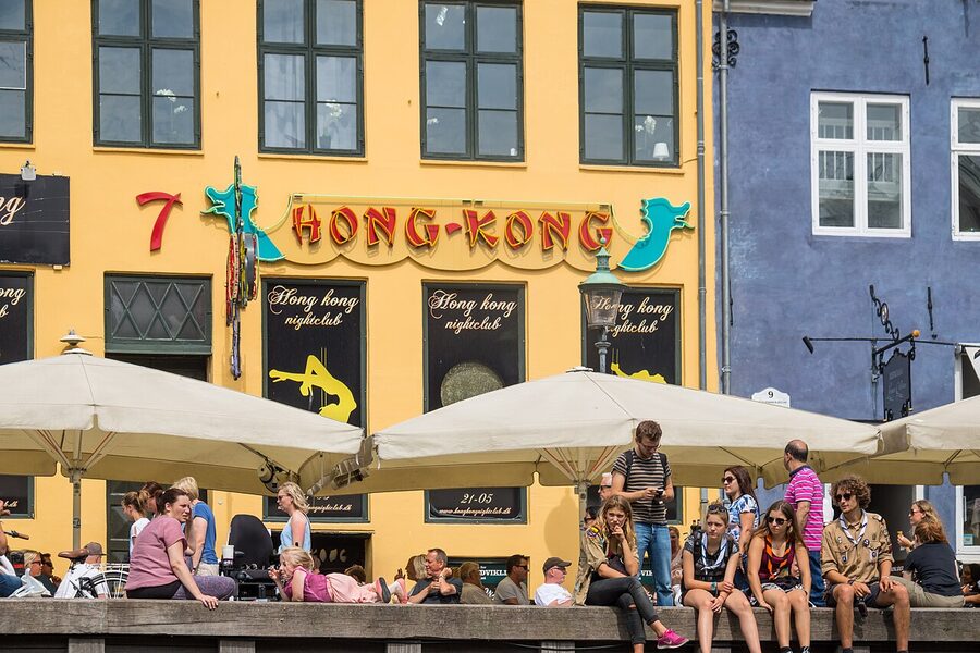 A colorful Nyhavn restaurant scene by the canal in Copenhagen