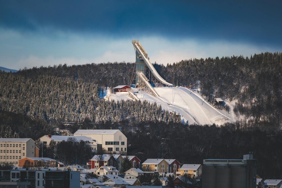Holmenkollen ski jump, Oslo, with snowy forest below
