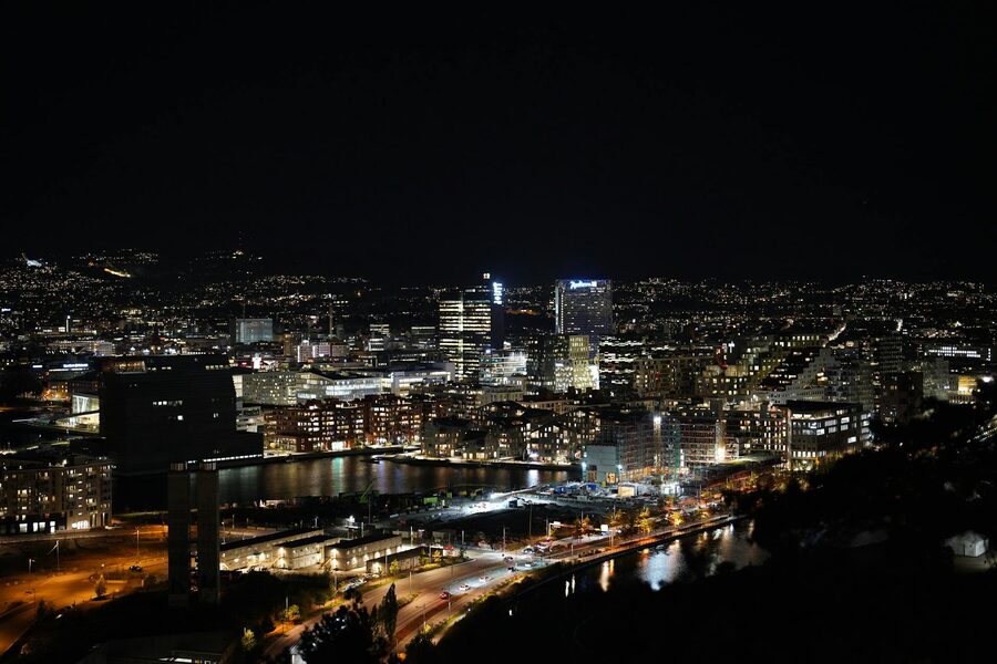 Oslo skyline at night with lights and modern buildings