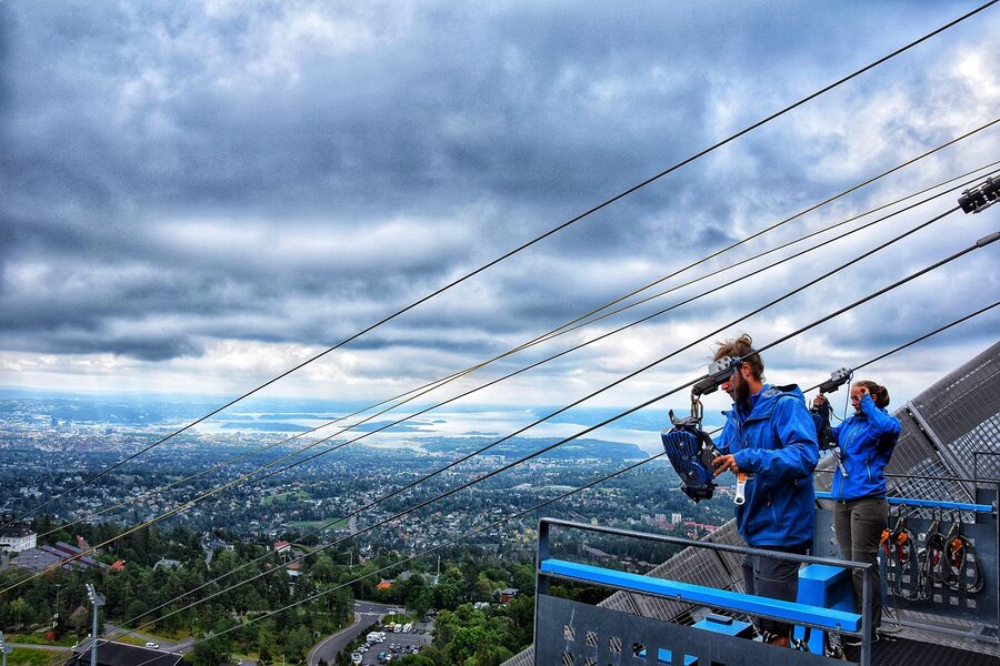 Holmenkollen ski jump in summer with green forest