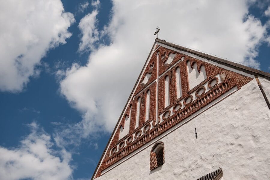 Brick wall and detail of Porvoo cathedral against blue sky