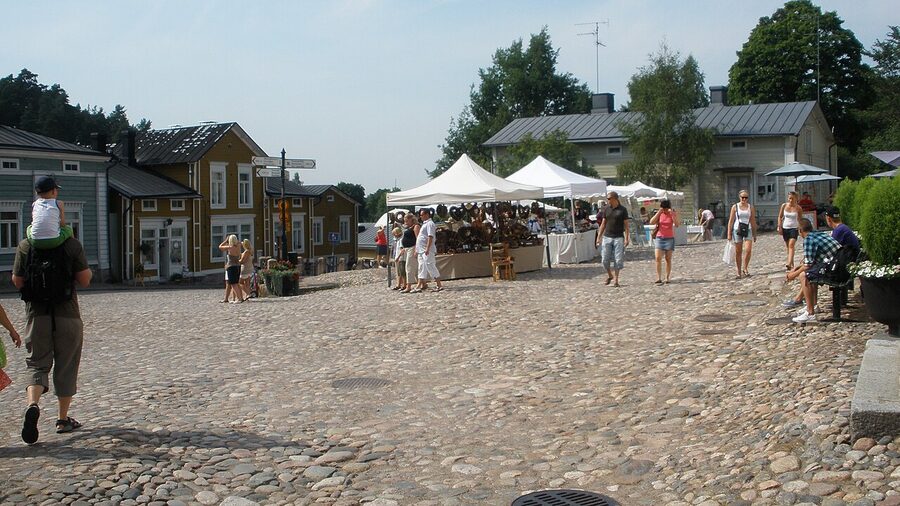 Aerial view of Porvoo Old Town from the south showing river, warehouses, lanes, and cathedral