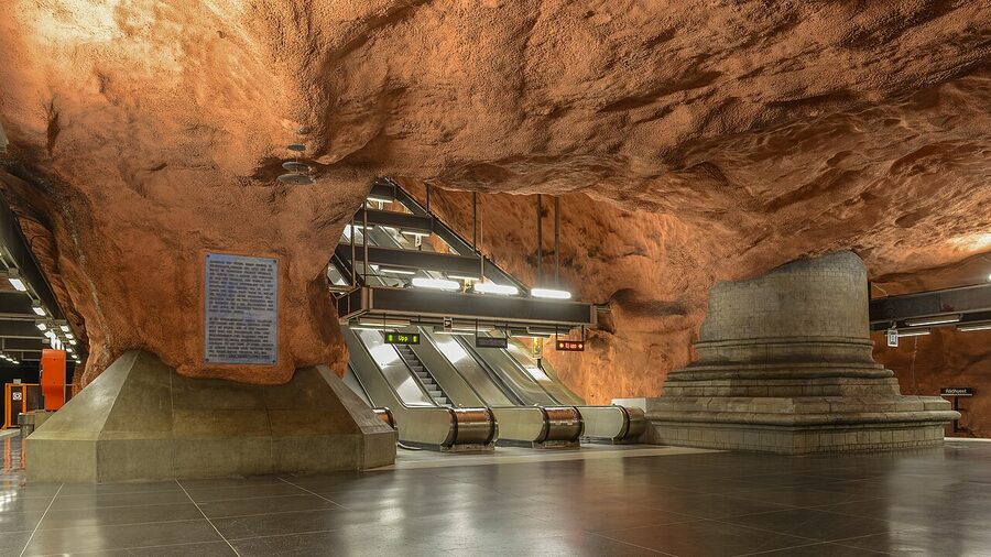 Rådhuset metro station Stockholm with the rough red-painted cave walls and exposed bedrock