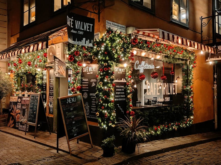 Stockholm pedestrian street with elaborate Christmas light installations strung between historic buildings