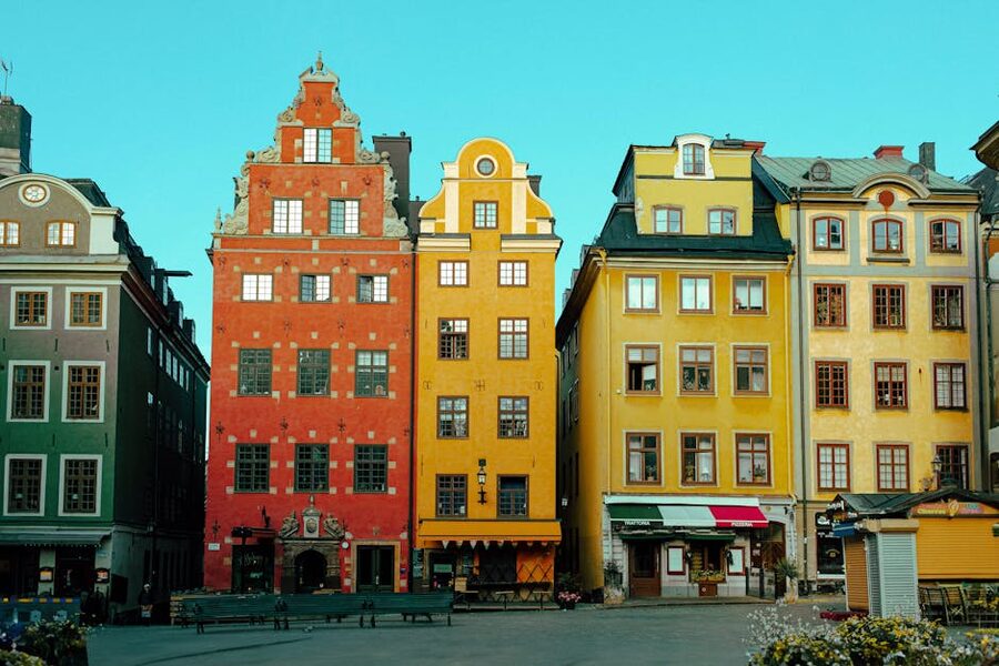Stortorget square covered in snow with the Nobel Museum building visible behind the Christmas market stalls