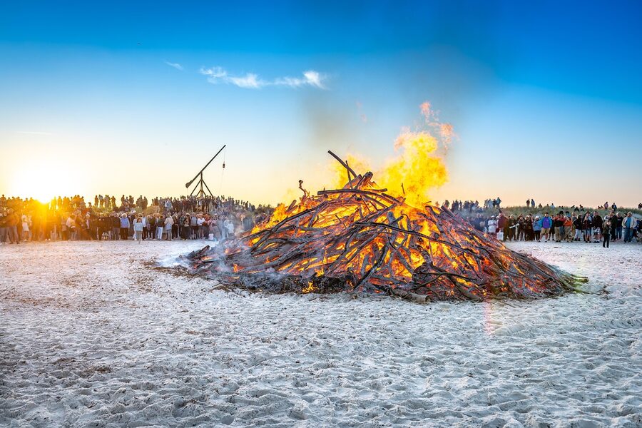 A Sankt Hans Eve bonfire on the beach at Skagen during midsummer