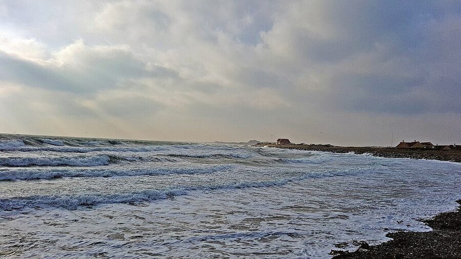 Choppy winter waves crashing at a Skagen beach