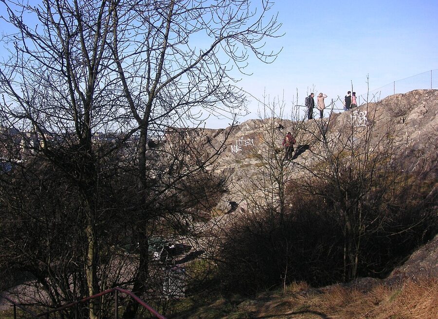 Skinnarviksberget, the highest natural point in central Stockholm, granite outcrop with view of city skyline