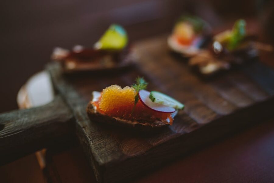 A modern smørrebrød with fish roe and radish in a Selma-like new-Nordic style