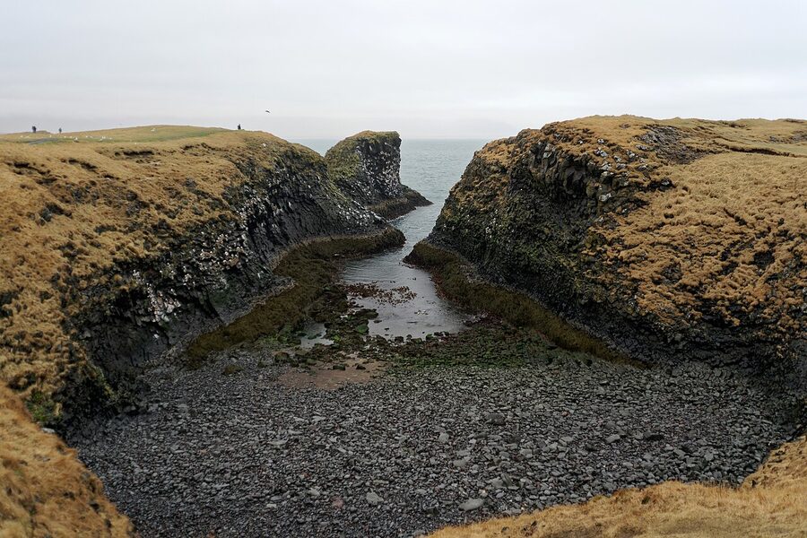 Arnarstapi sea cliffs with basalt formations and Atlantic surf