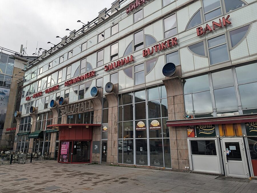 Södermalms Saluhall food hall interior with food stalls and a glass roof
