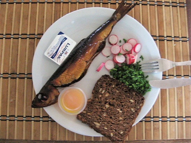 A close-up of the Sol over Gudhjem with a runny yolk over smoked herring
