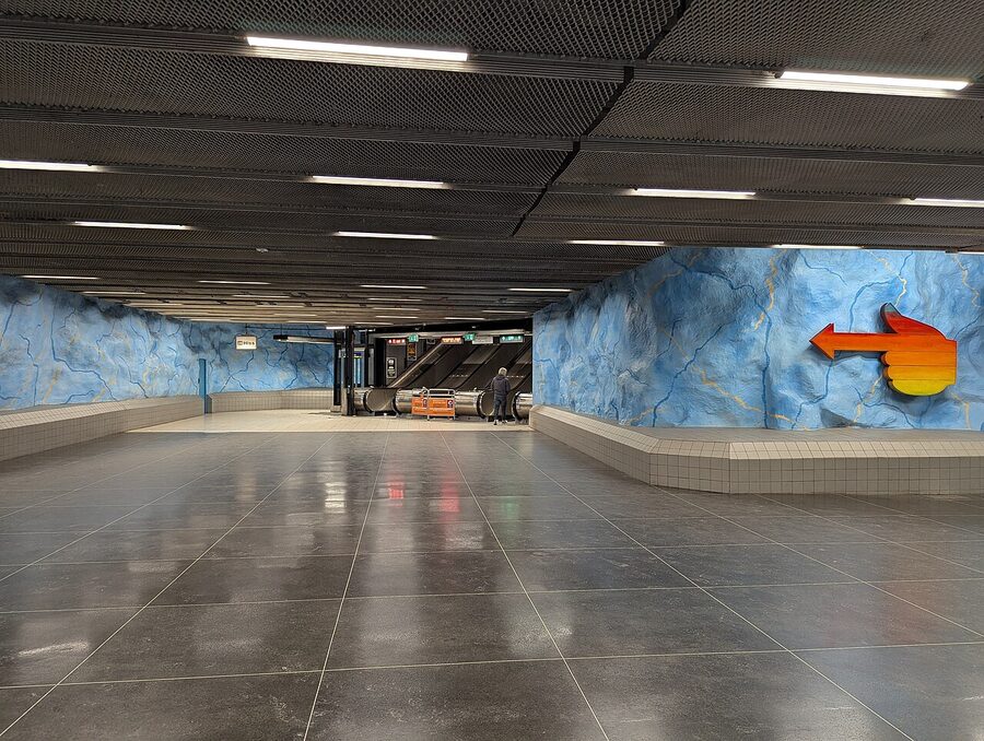 Stadion metro station Stockholm with the rainbow painted onto the rough cave ceiling above the platform