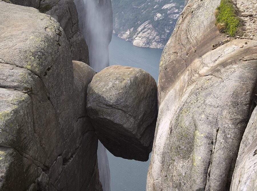 Hiker on Kjerag plateau above Lysefjord