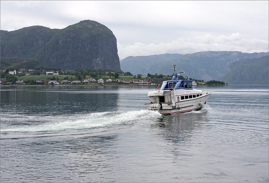 Lysefjord cruise boat between cliffs
