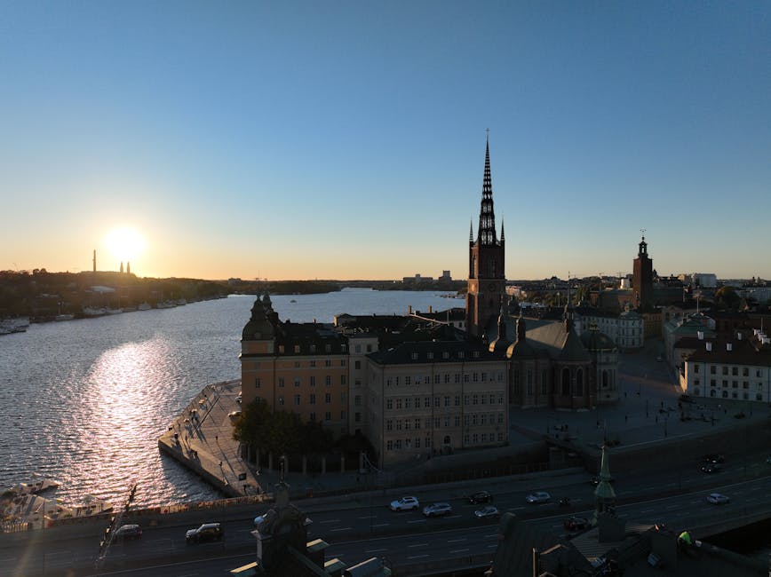 Aerial view of Riddarholmen Stockholm at sunset with golden light on the water and the church spire