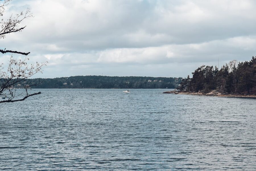 Stockholm archipelago seen from a ferry deck under cloudy sky