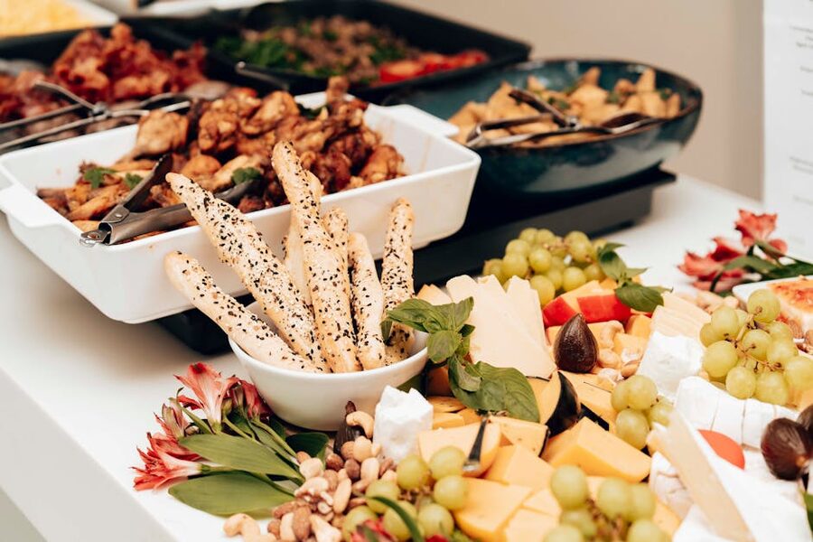Buffet table with assorted cheeses and snacks