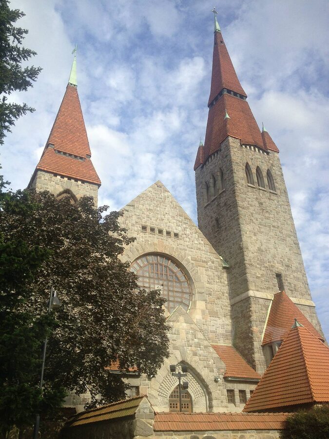 The grey-stone Tampere Cathedral on Hämeenpuisto in summer