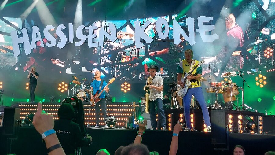 A concert at Ratina Stadium in Tampere with a packed crowd at sunset