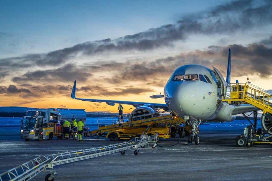 Aircraft de-icing at Kiruna Airport at sunrise