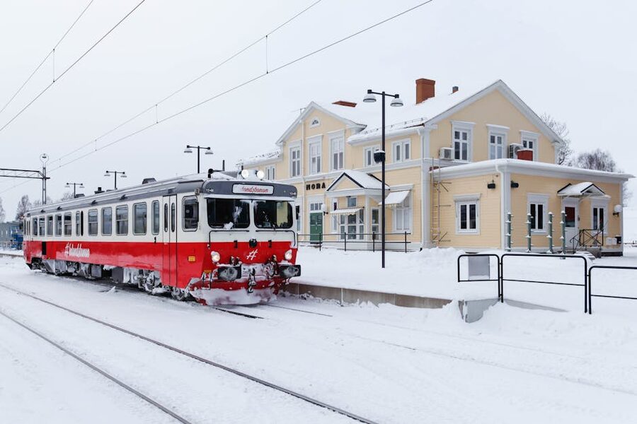 Red train at Mora station in snow