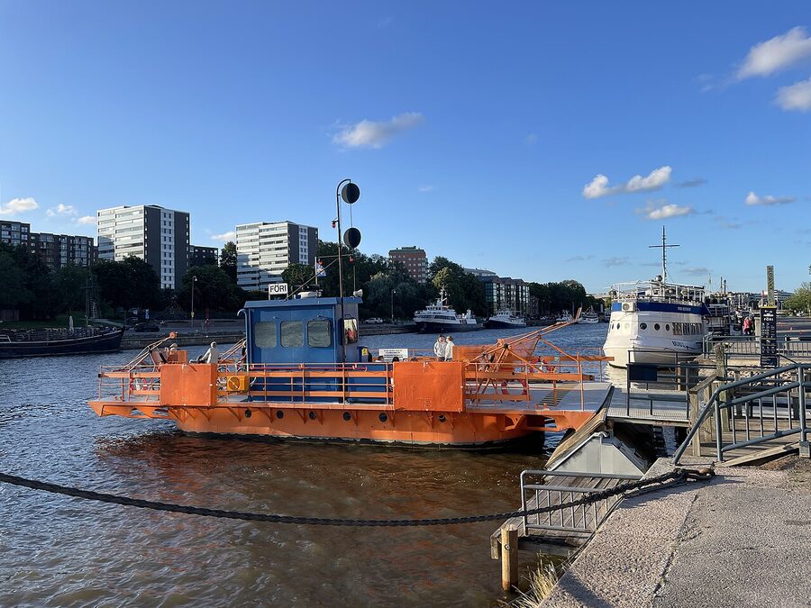 The Föri ferry in winter on the Aurajoki river with snow on the banks