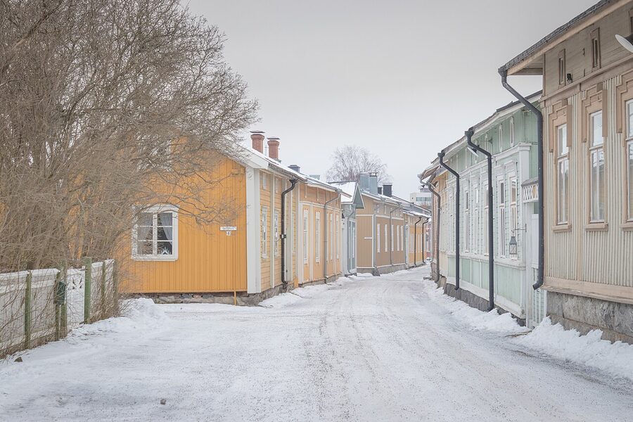 A wooden street in Naantali with red and yellow painted houses