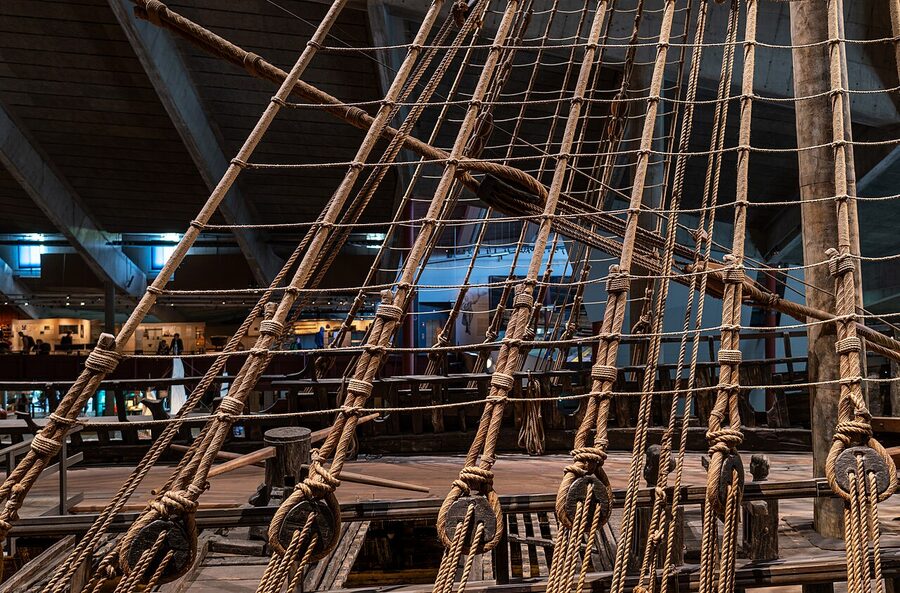 Vasa ship rigging and masts inside the Vasa Museum, the dark wooden structure and ropes against the museum's high ceiling
