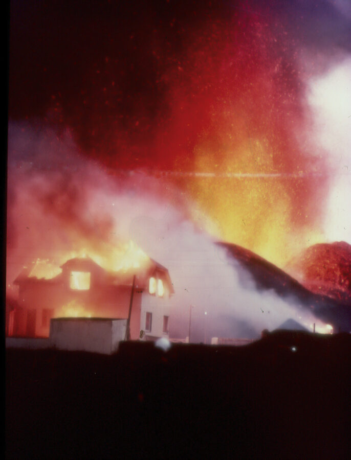 House on fire from advancing lava, Heimaey 1973
