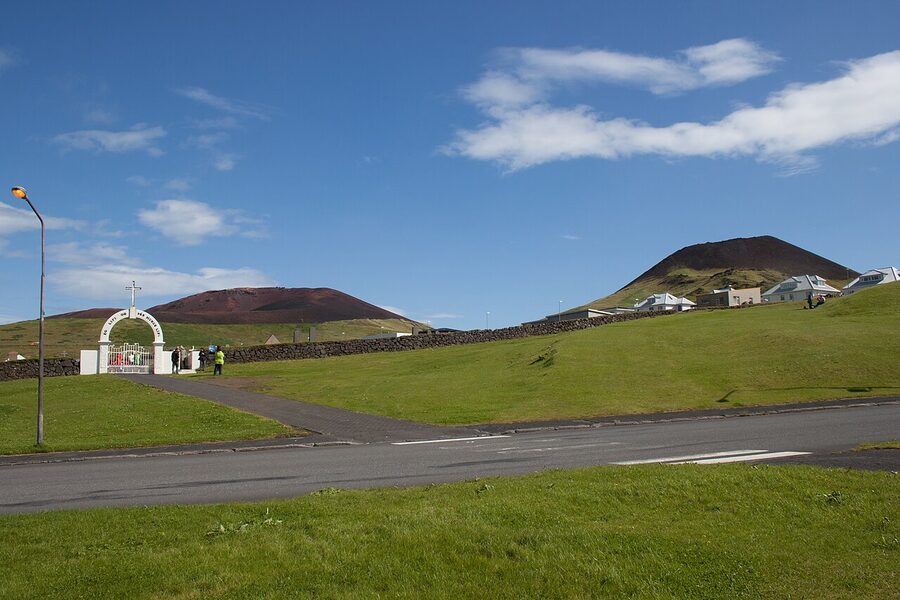 The town with Eldfell and Helgafell behind