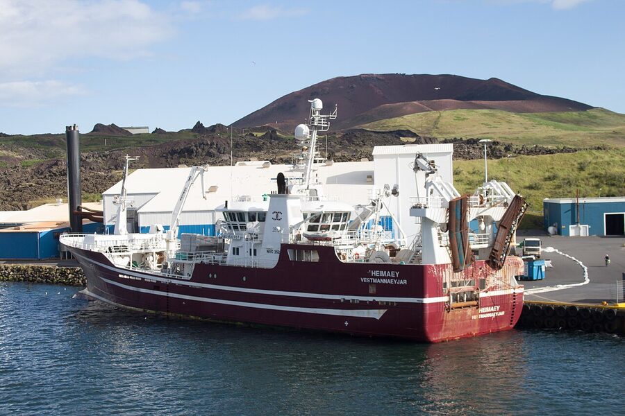 Trawler in Vestmannaeyjar harbour with Eldfell behind